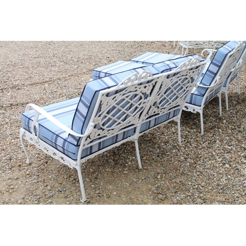 519 - White painted cast metal garden / patio sun lounger set comprising a twin seat (approx 123cm wide) a... 