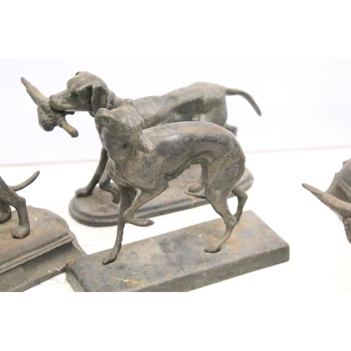 488 - Group of five cast iron dog ornaments and a horse example, tallest approx 18cm