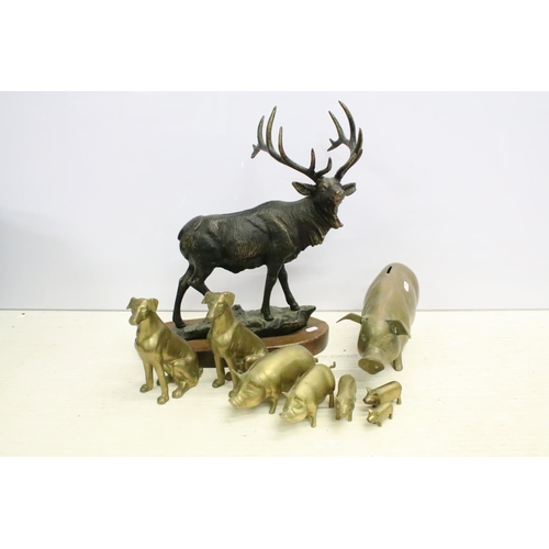 506 - Cast metal model of a stag mounted on a wooden base (approx 45cm high), together with a group of bra... 