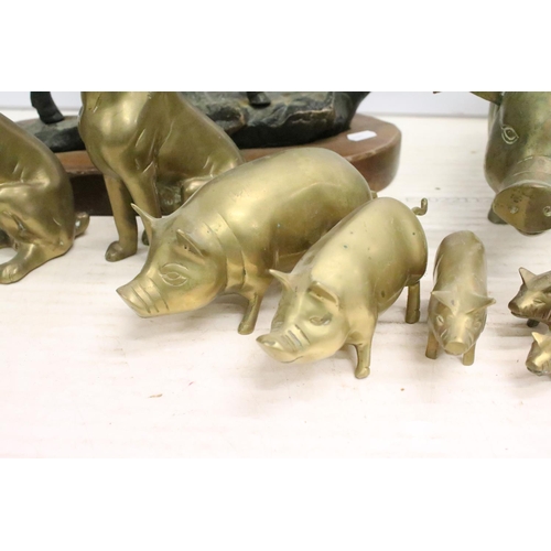 506 - Cast metal model of a stag mounted on a wooden base (approx 45cm high), together with a group of bra... 