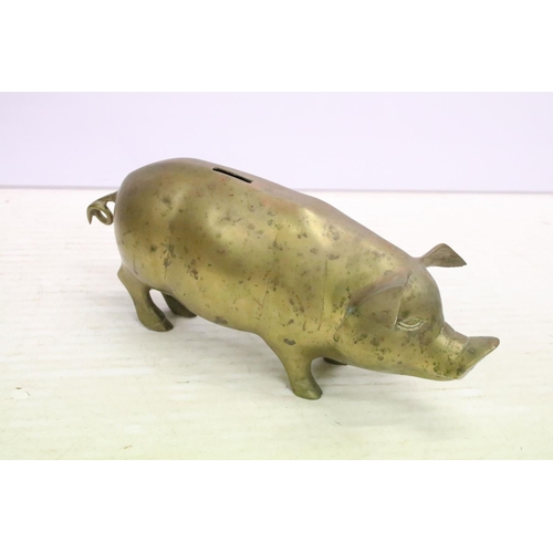 506 - Cast metal model of a stag mounted on a wooden base (approx 45cm high), together with a group of bra... 