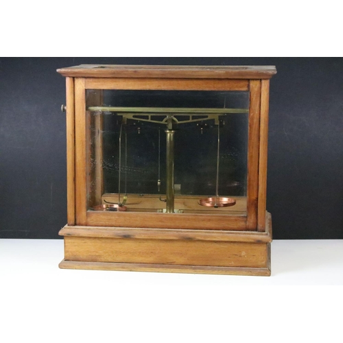 510 - Set of brass scales with copper pans, one depicting the Commonwealth Stadium, Edmonton, Alberta, hou... 