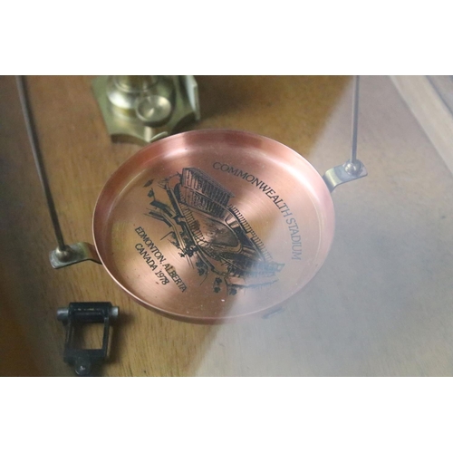 510 - Set of brass scales with copper pans, one depicting the Commonwealth Stadium, Edmonton, Alberta, hou... 