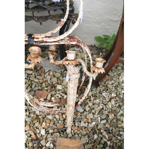 524 - Two pairs of iron garden bench supports to include a pair of white painted examples, together with a... 