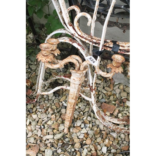 524 - Two pairs of iron garden bench supports to include a pair of white painted examples, together with a... 