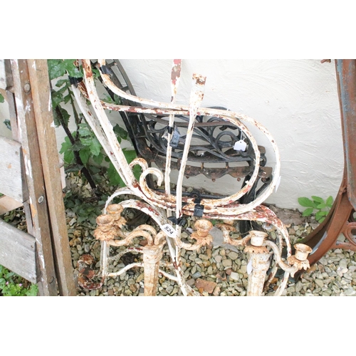 524 - Two pairs of iron garden bench supports to include a pair of white painted examples, together with a... 