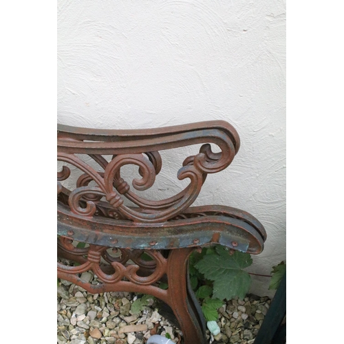 525 - Two pairs of cast iron garden bench supports of scrolled form, tallest approx 81cm