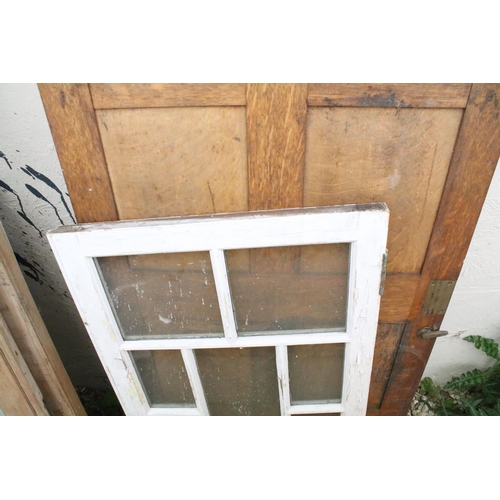 531 - Collection of ten vintage wooden furniture doors to include glazed examples, featuring a pair of gla... 