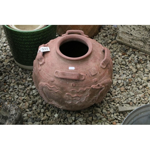 533 - Terracotta vase / planter of circular form, with relief dragon decoration and four handles, approx 4... 