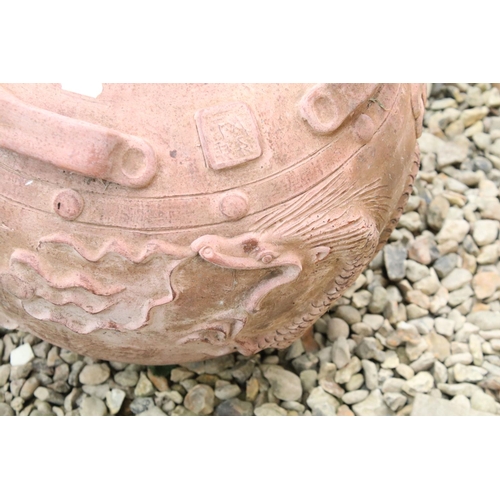 533 - Terracotta vase / planter of circular form, with relief dragon decoration and four handles, approx 4... 