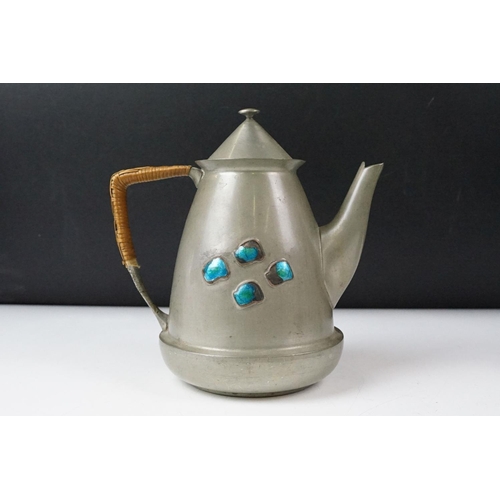 254 - An early twentieth century pewter tea set with peacock enamel decoration in the style of archibald k... 