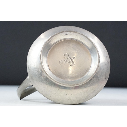 254 - An early twentieth century pewter tea set with peacock enamel decoration in the style of archibald k... 