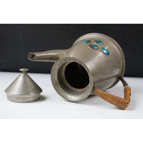 254 - An early twentieth century pewter tea set with peacock enamel decoration in the style of archibald k... 
