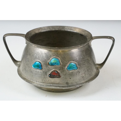 254 - An early twentieth century pewter tea set with peacock enamel decoration in the style of archibald k... 