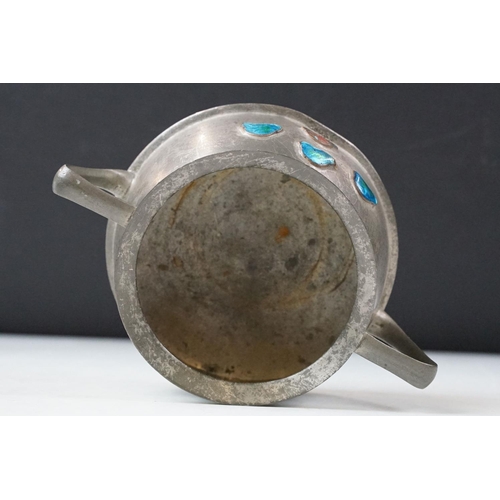 254 - An early twentieth century pewter tea set with peacock enamel decoration in the style of archibald k... 