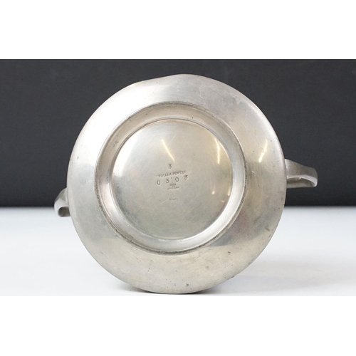 254 - An early twentieth century pewter tea set with peacock enamel decoration in the style of archibald k... 