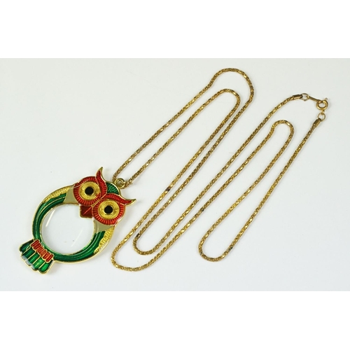 281 - Gilt and enamel magnifying pendant and chain