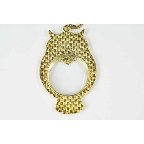 281 - Gilt and enamel magnifying pendant and chain