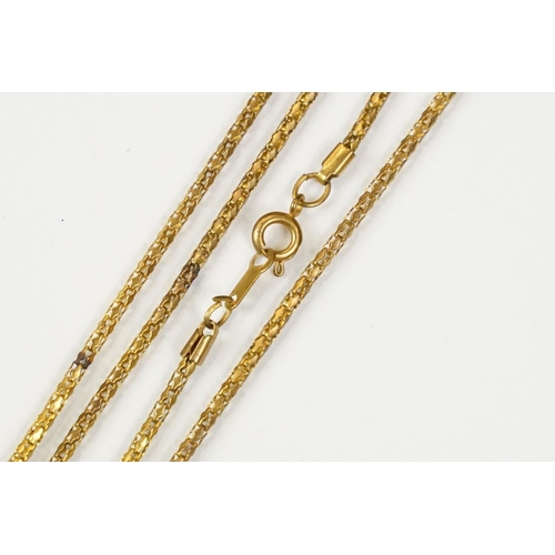 281 - Gilt and enamel magnifying pendant and chain