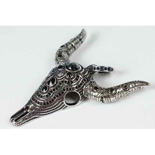 285 - A 925 sterling silver and onyx pendant in the form of a horned bulls skull.