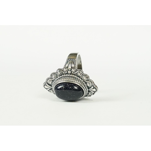 288 - A contemporary 925 sterling silver ring with central cabochon, marked 925 to the verso.