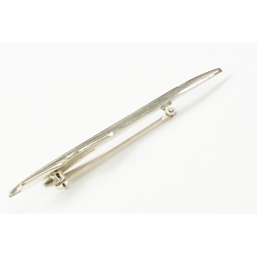 301 - A sterling silver badge / brooch in the form of 
Concorde, marked silver to the verso.