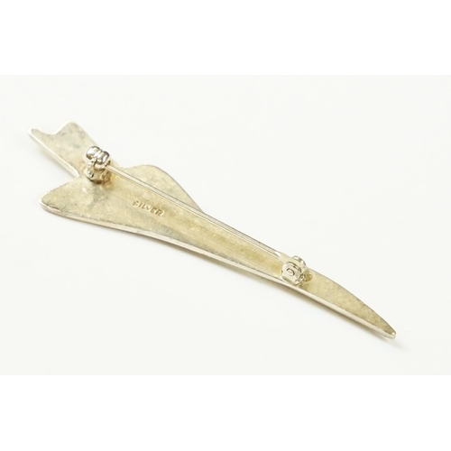 301 - A sterling silver badge / brooch in the form of 
Concorde, marked silver to the verso.