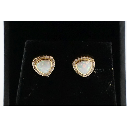 303 - Pair of gold plated and silver opal and CZ earrings