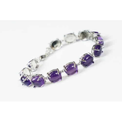 304 - A 925 Sterling Silver and amethyst bracelet, marked 925 to the clasp.