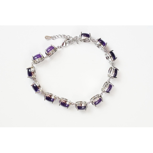 304 - A 925 Sterling Silver and amethyst bracelet, marked 925 to the clasp.