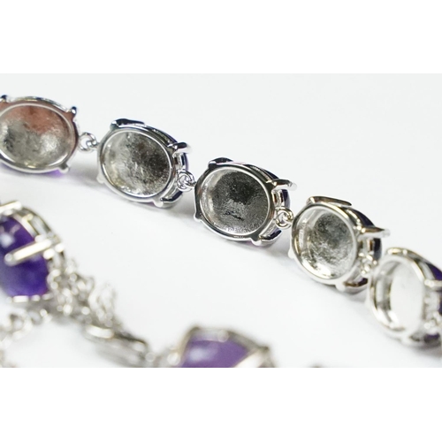304 - A 925 Sterling Silver and amethyst bracelet, marked 925 to the clasp.