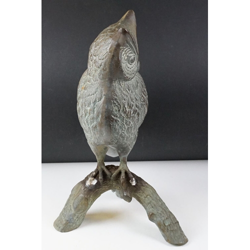430 - Large metal model of an owl perched on a branch, with verdigris effect finish, approx 48cm high
