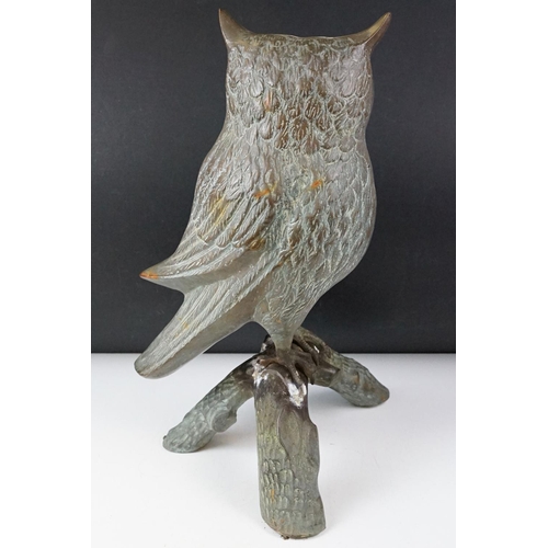 430 - Large metal model of an owl perched on a branch, with verdigris effect finish, approx 48cm high