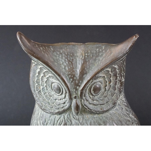 430 - Large metal model of an owl perched on a branch, with verdigris effect finish, approx 48cm high