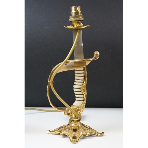 431 - Pair of brass table lamps of classical form, the supports modelled as spiralling leaves with soldier... 