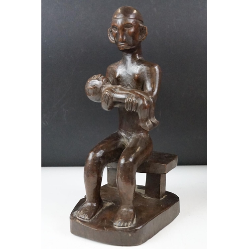 434 - Collection of carved wooden figurines to include some African Tribal examples,  a mother and child f... 