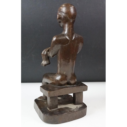 434 - Collection of carved wooden figurines to include some African Tribal examples,  a mother and child f... 