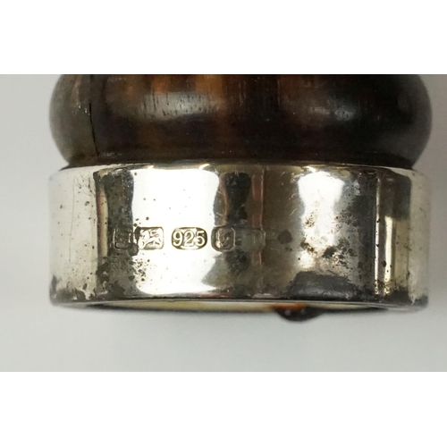 435 - Two 'British Coal Mining' brass miners lamps, together with a pair of barley twist wooden candlestic... 