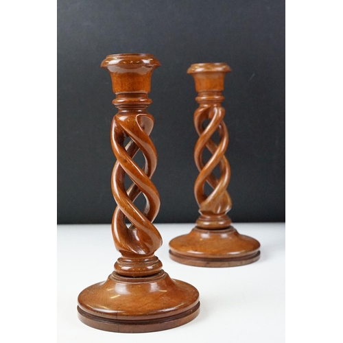 435 - Two 'British Coal Mining' brass miners lamps, together with a pair of barley twist wooden candlestic... 