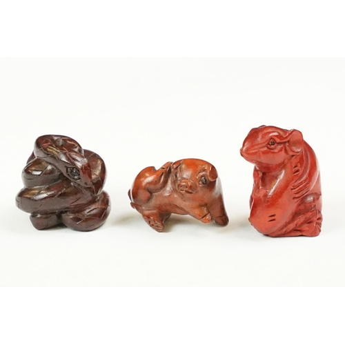 202 - A collection of three carved oriental Netsuke in the form of animals.