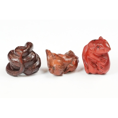202 - A collection of three carved oriental Netsuke in the form of animals.