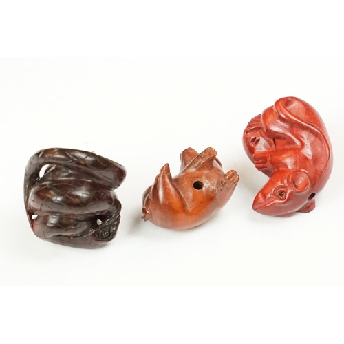 202 - A collection of three carved oriental Netsuke in the form of animals.