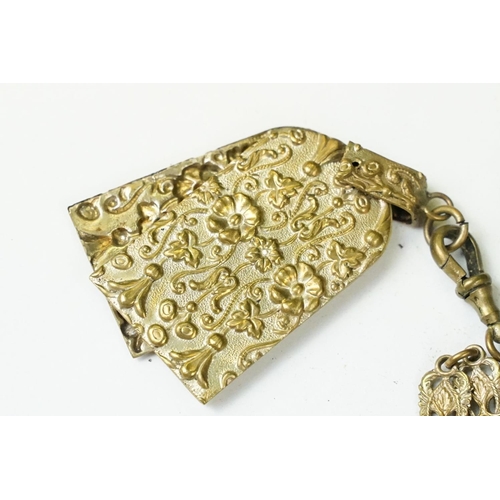 208 - An antique brass Chatelaine complete with pencil, pin cushion, scissors and thimble.