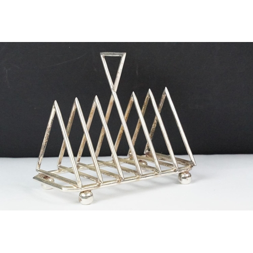 210 - Silver plated six section art deco style toast rack on bun feet