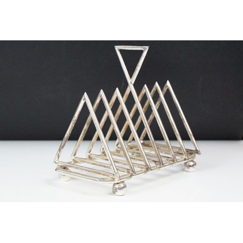 210 - Silver plated six section art deco style toast rack on bun feet