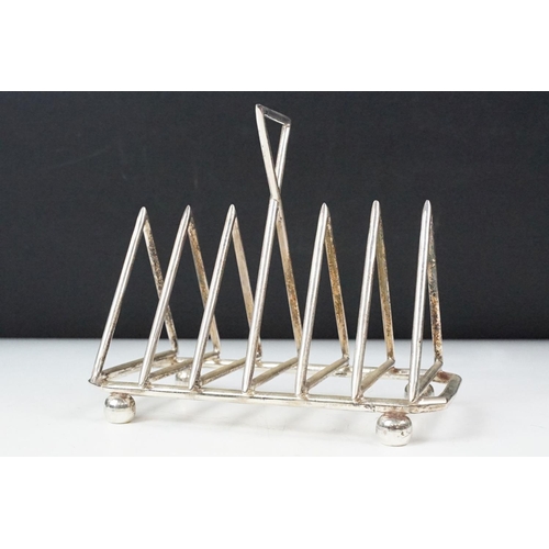 210 - Silver plated six section art deco style toast rack on bun feet
