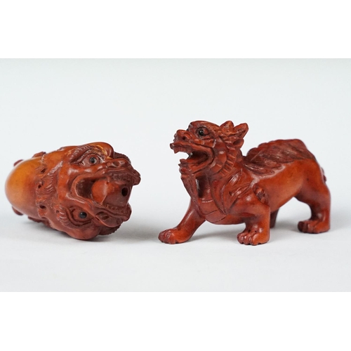 218 - Two carved oriental Netsuke in the form of mythical creatures.