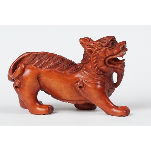 218 - Two carved oriental Netsuke in the form of mythical creatures.