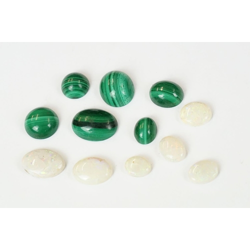 232 - A small collection of opal and malachite polished cobochons.