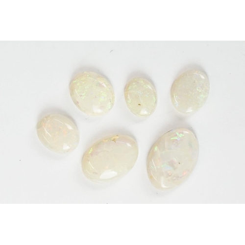 232 - A small collection of opal and malachite polished cobochons.